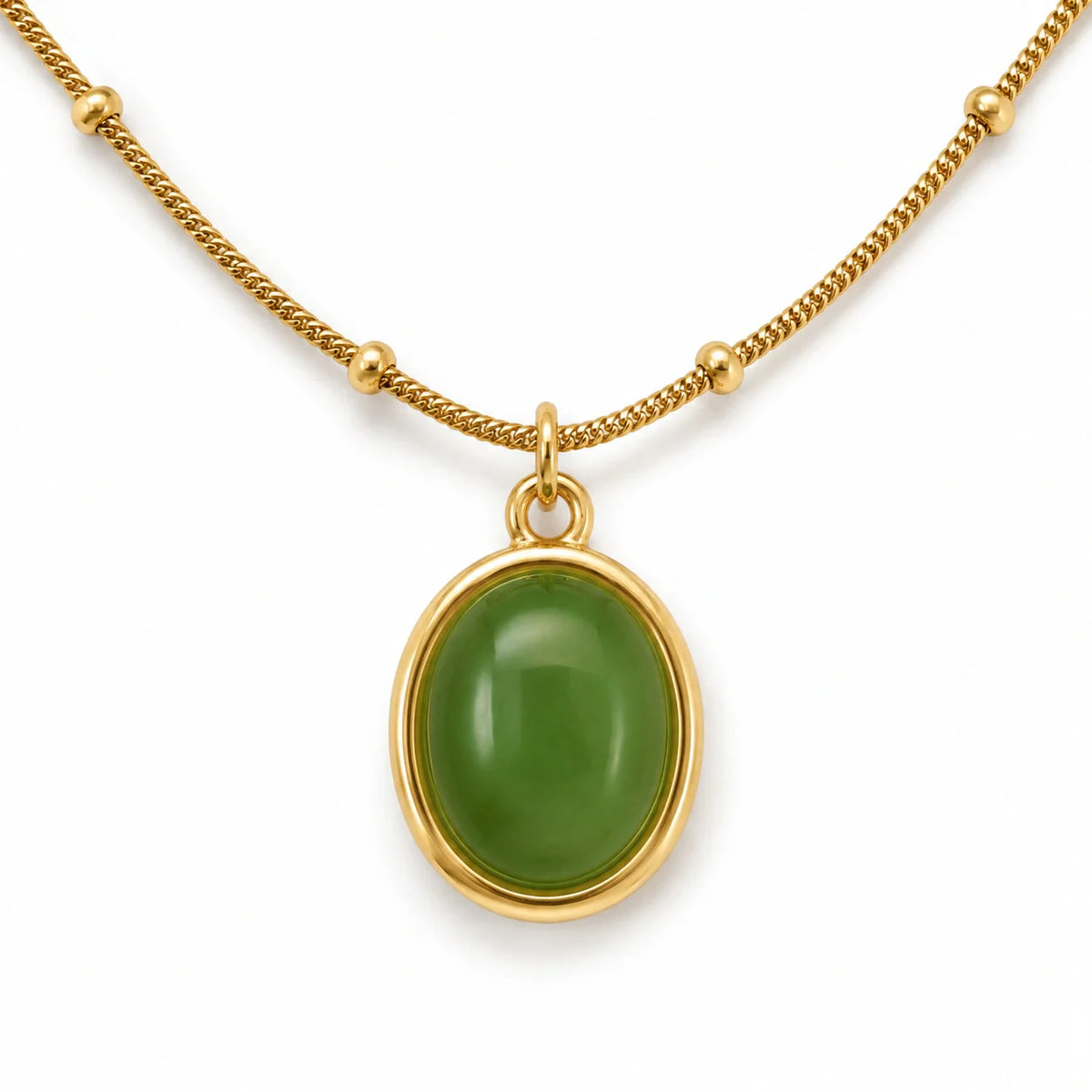 Gold-tone green oval cabochon bead pendant necklace styled as jewellery inspiration for a green dress