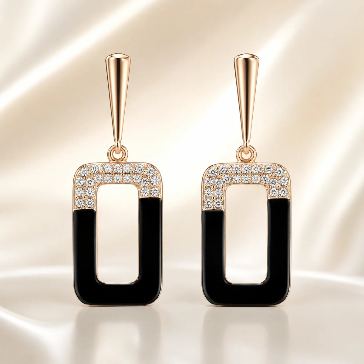 Rose-gold black geometric dangle earrings styled as jewellery inspiration for a black dress