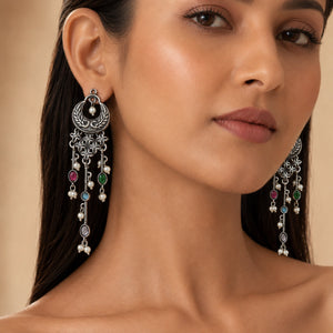 Angled view of antique German silver multicolor pearl chandelier earrings
