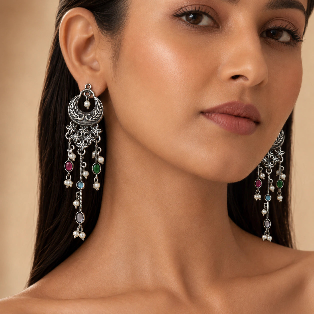 Angled view of antique German silver multicolor pearl chandelier earrings