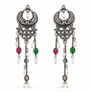 Close-up of multicolor accents, pearl-style beads and antique chandelier detailing