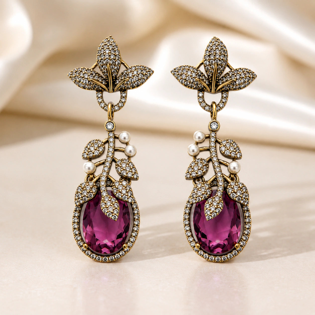 Angled view of antique gold purple leaf chandelier earrings
