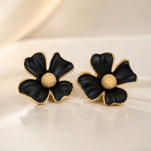 Close-up of black floral petals and gold-tone detailing