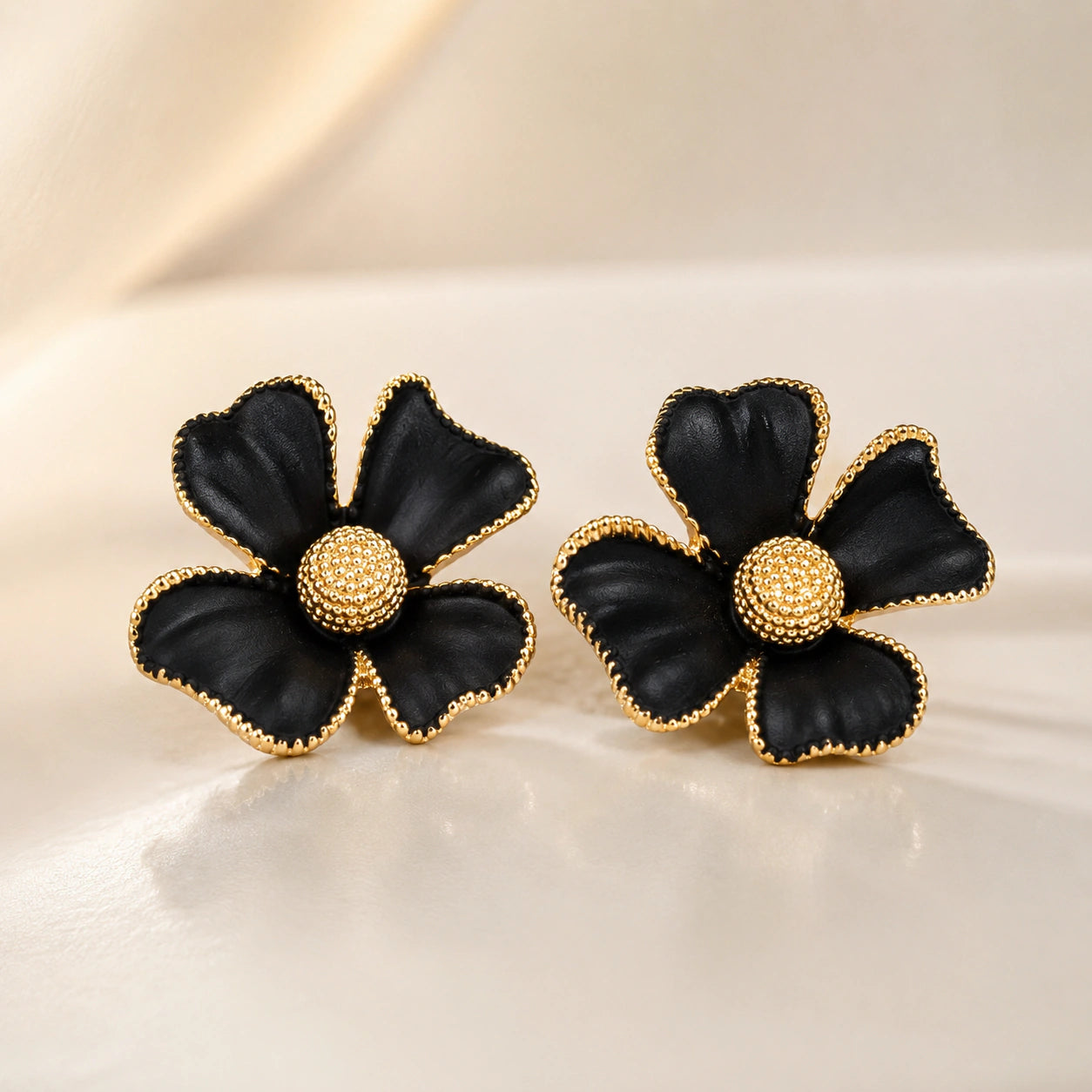Close-up of black floral petals and gold-tone detailing