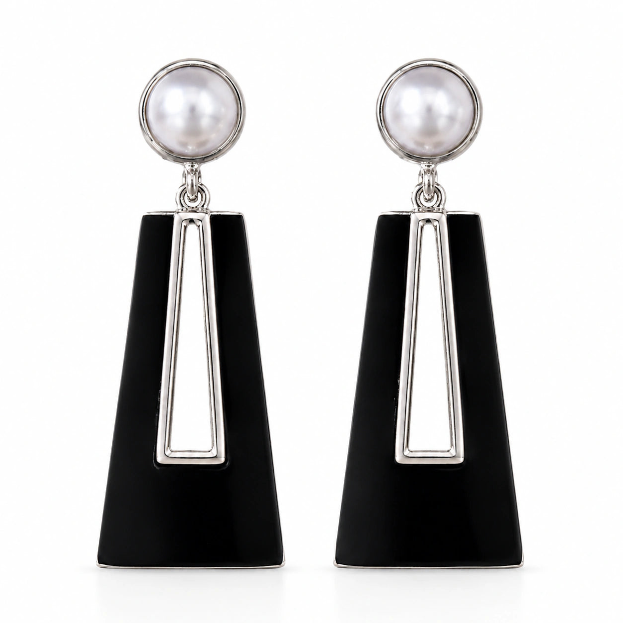 Close-up of black geometric forms and pearl-style drops