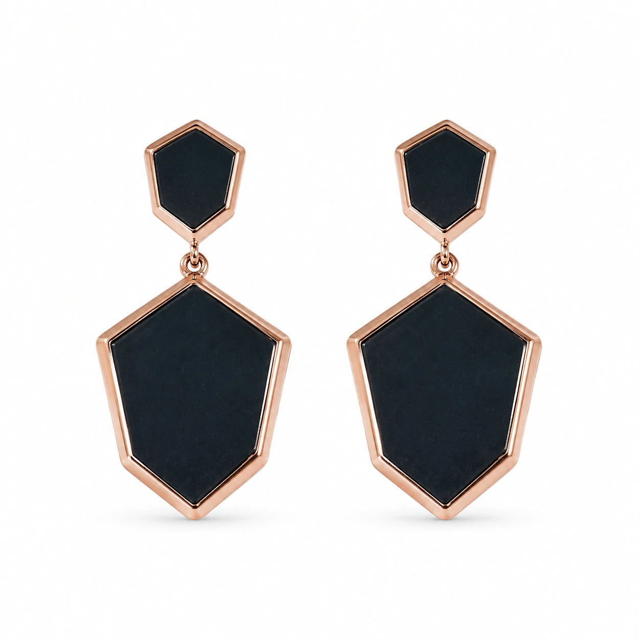Angled view of black rose-gold geometric drop earrings