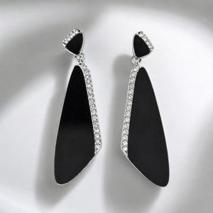 Close-up of black geometric panels and silver crystal-style detailing