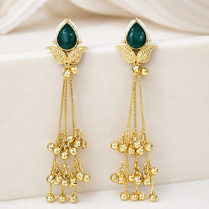 Angled view of brass-gold green Kundan pearl chandelier earrings