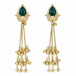 Brass-gold green Kundan pearl chandelier statement earrings worn by a model