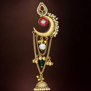 Close-up ear view showing layered chandbali, jhumka and pearl-style details