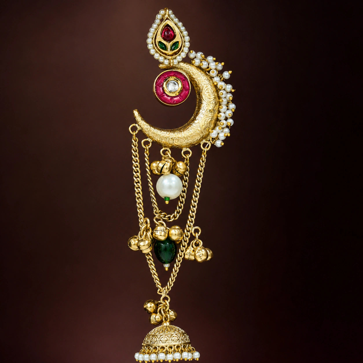 Close-up ear view showing layered chandbali, jhumka and pearl-style details