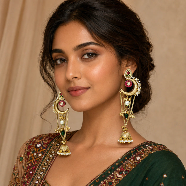 Close-up of Kundan-style stones, pearl accents and brass-gold chandbali jhumka detailing