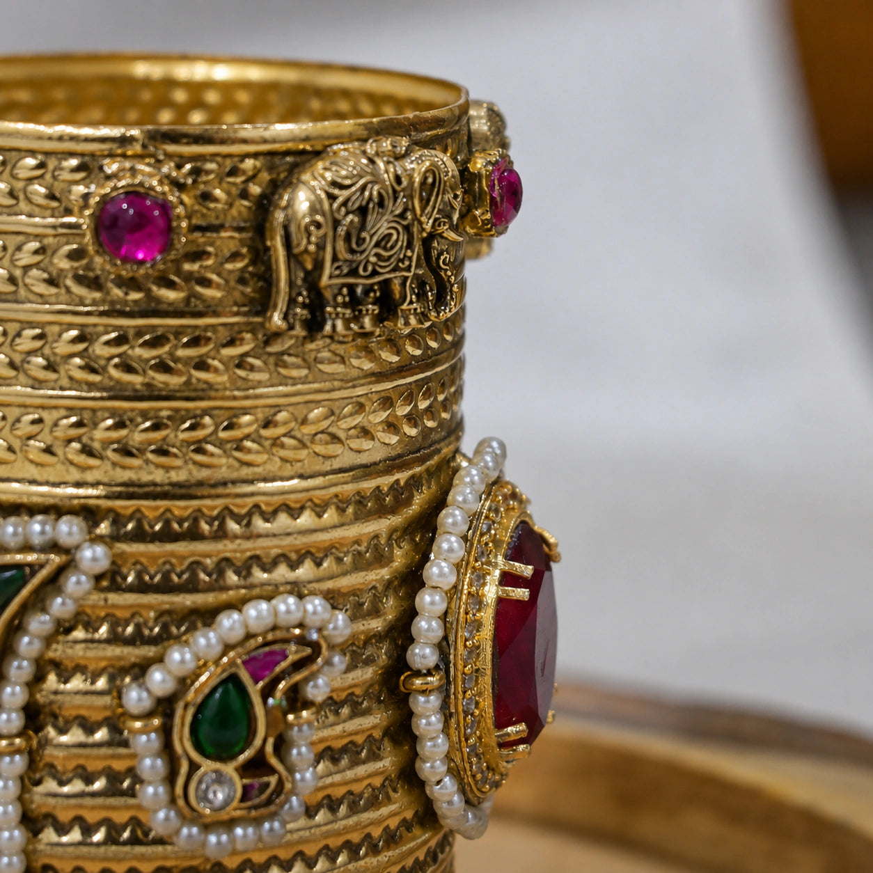 Open structure view of the red Kundan handwork kada