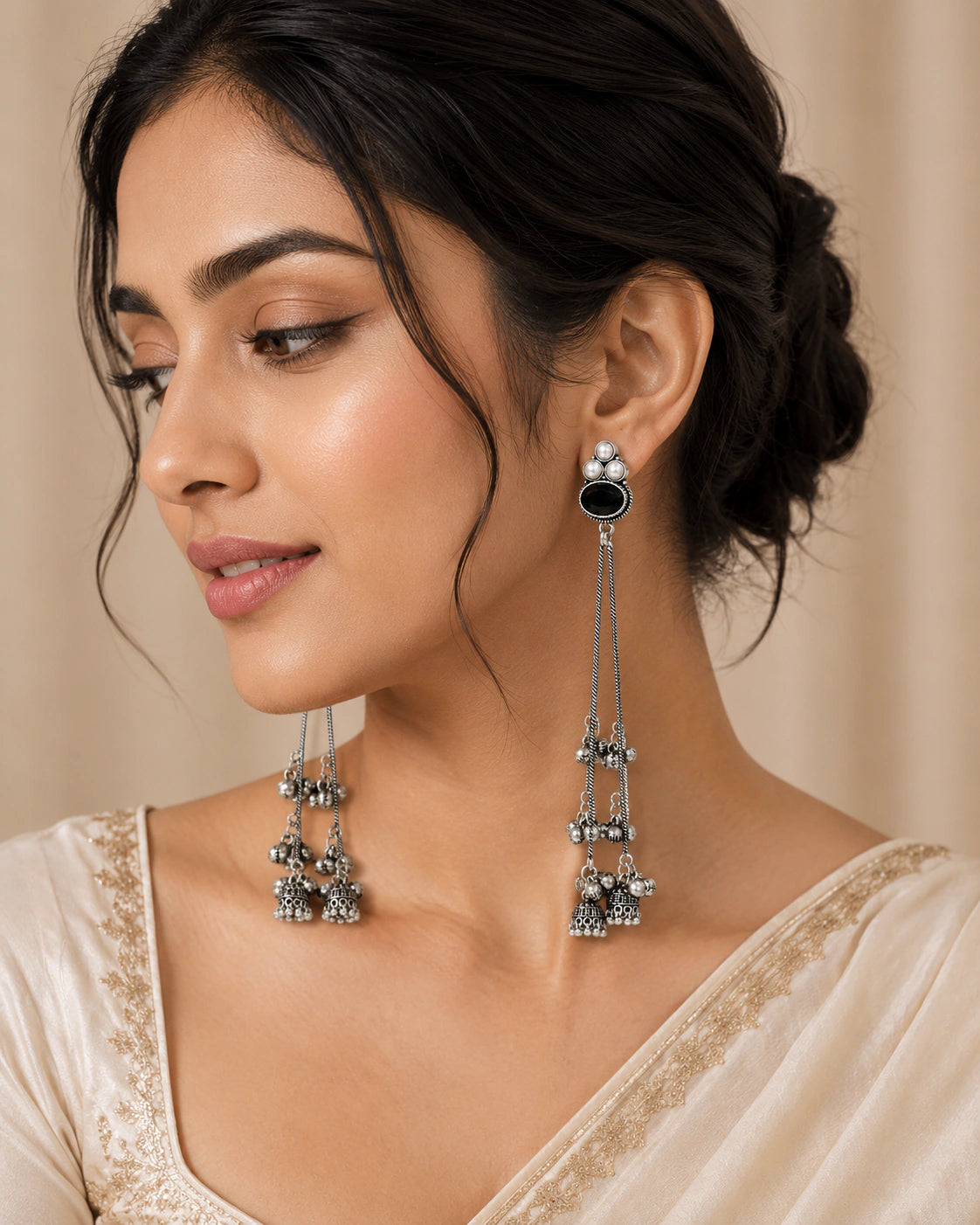 German silver black pearl-style jhumka earrings worn by a model