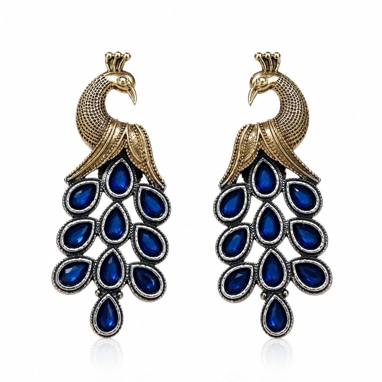 Angled view of German silver peacock earrings with blue-stone chandelier drops