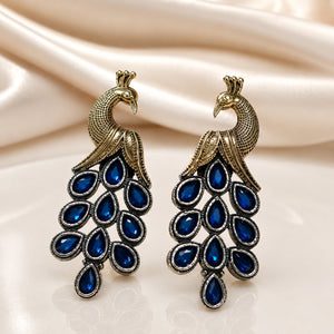 Close-up of blue imitation stones and antique-finish peacock chandelier detailing