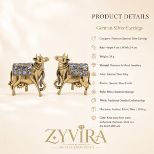 Product details card for German silver gold cow-motif crystal drop earrings