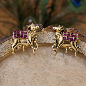 Alternate detail view of gold maroon cow-motif dangle earrings