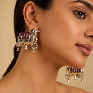 Alternate product view of German silver gold maroon cow-motif earrings