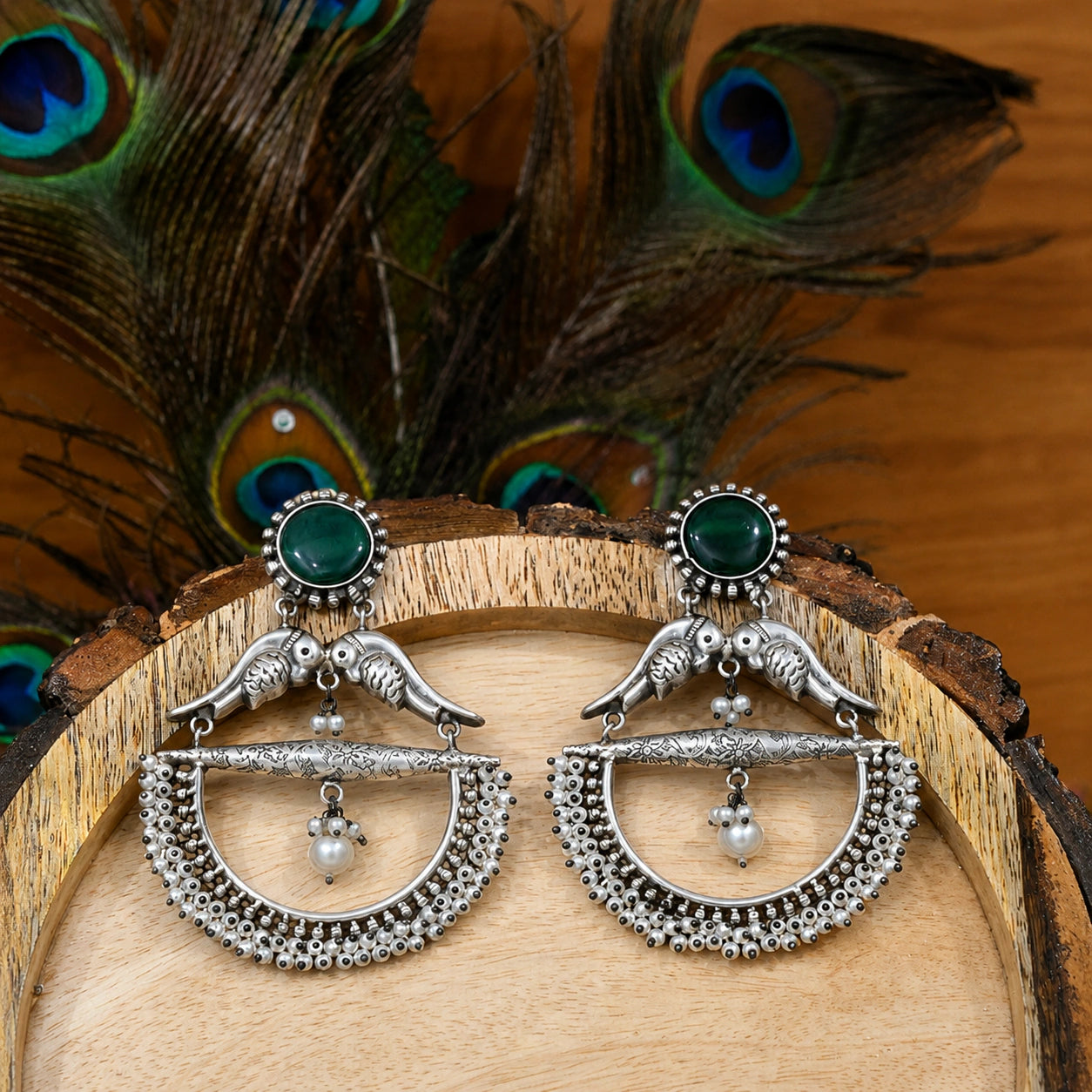 Side view of German silver green bird pearl chandelier earrings