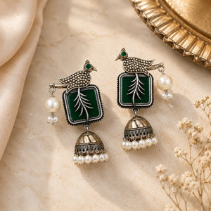 Alternate product view of German silver green bird-motif pearl jhumka earrings