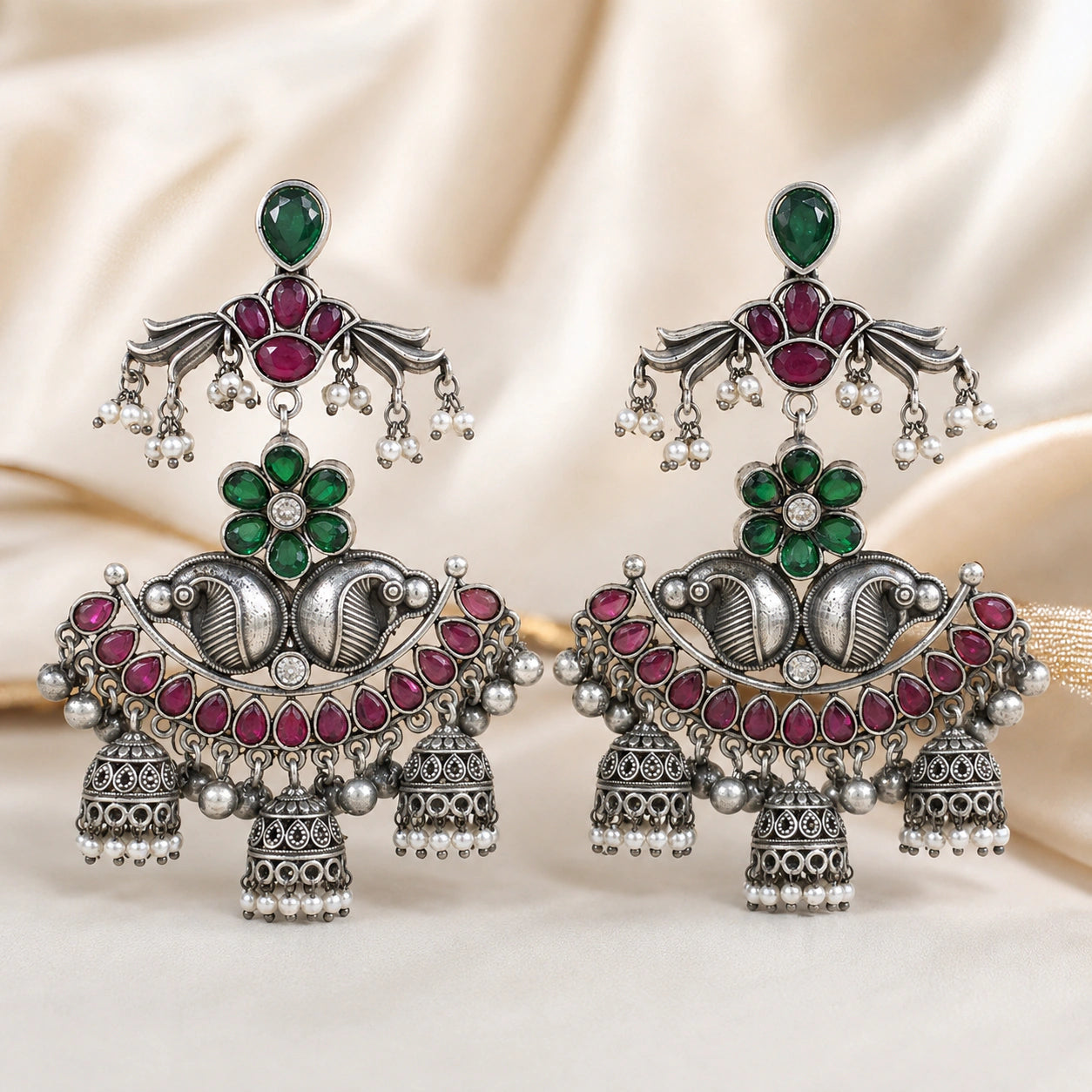 Close-up of green, maroon and pearl-style chandelier detailing