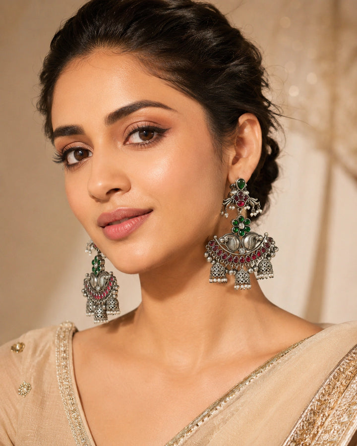 German silver green maroon pearl-style chandelier earrings worn by a model