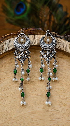 Alternate model view of green pearl-style chandelier earrings