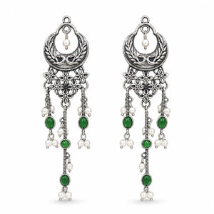 Close-up of green accents, pearl-style beads and chandelier detailing