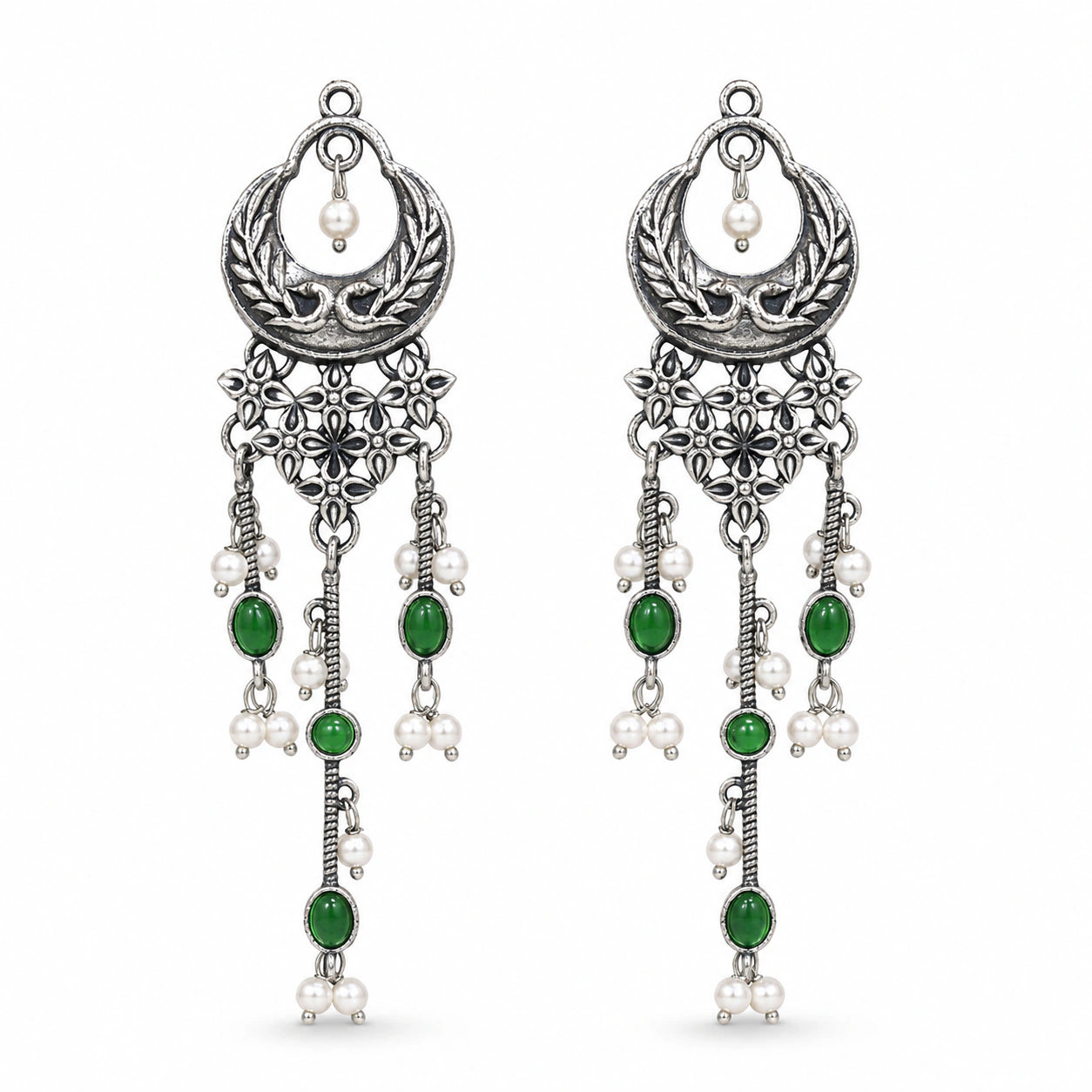 Close-up of green accents, pearl-style beads and chandelier detailing