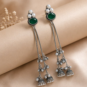 German silver green pearl tassel earrings styled in a jewellery flat lay