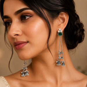 Close-up of green accents, pearl-style beads and German silver tassel detailing