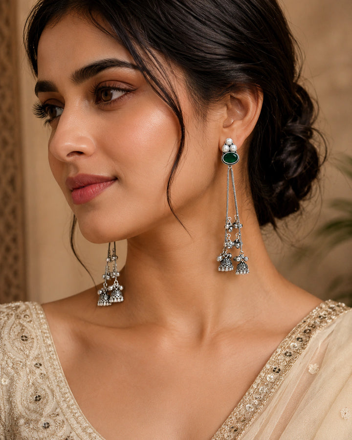 German silver green pearl tassel dangle earrings worn by a model