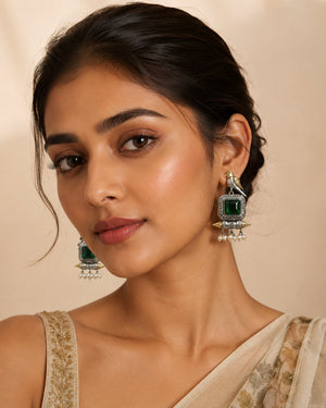 German silver green-stone bird pearl dangle earrings worn by a model