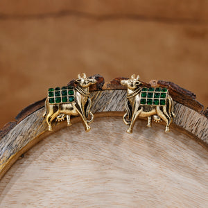 Alternate product view of German silver green-stone cow-motif earrings
