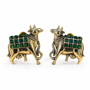 Close-up of green stones and German silver cow-motif detailing