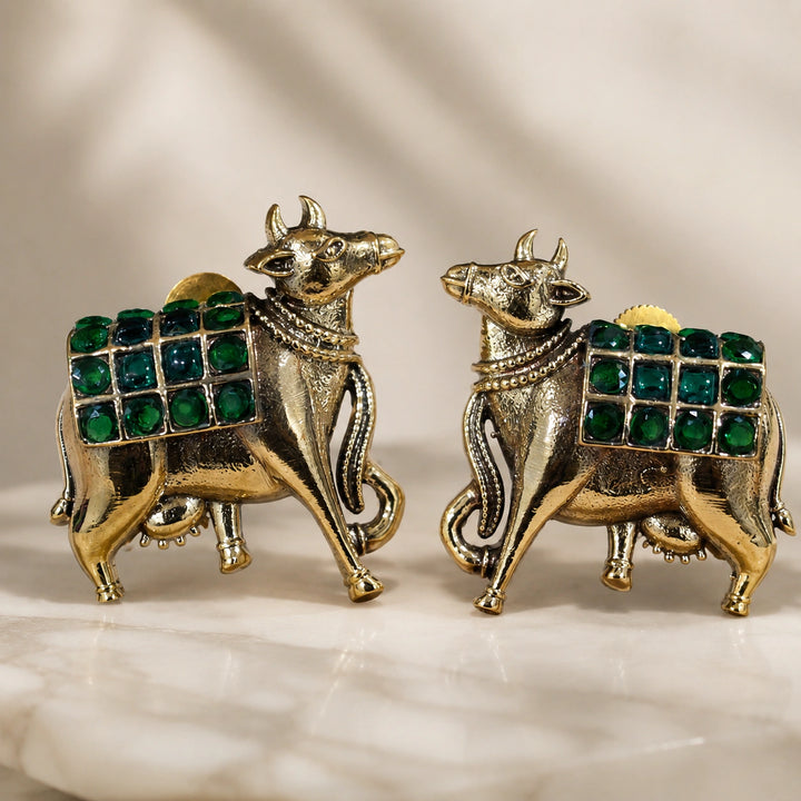 German silver green-stone cow-motif earrings