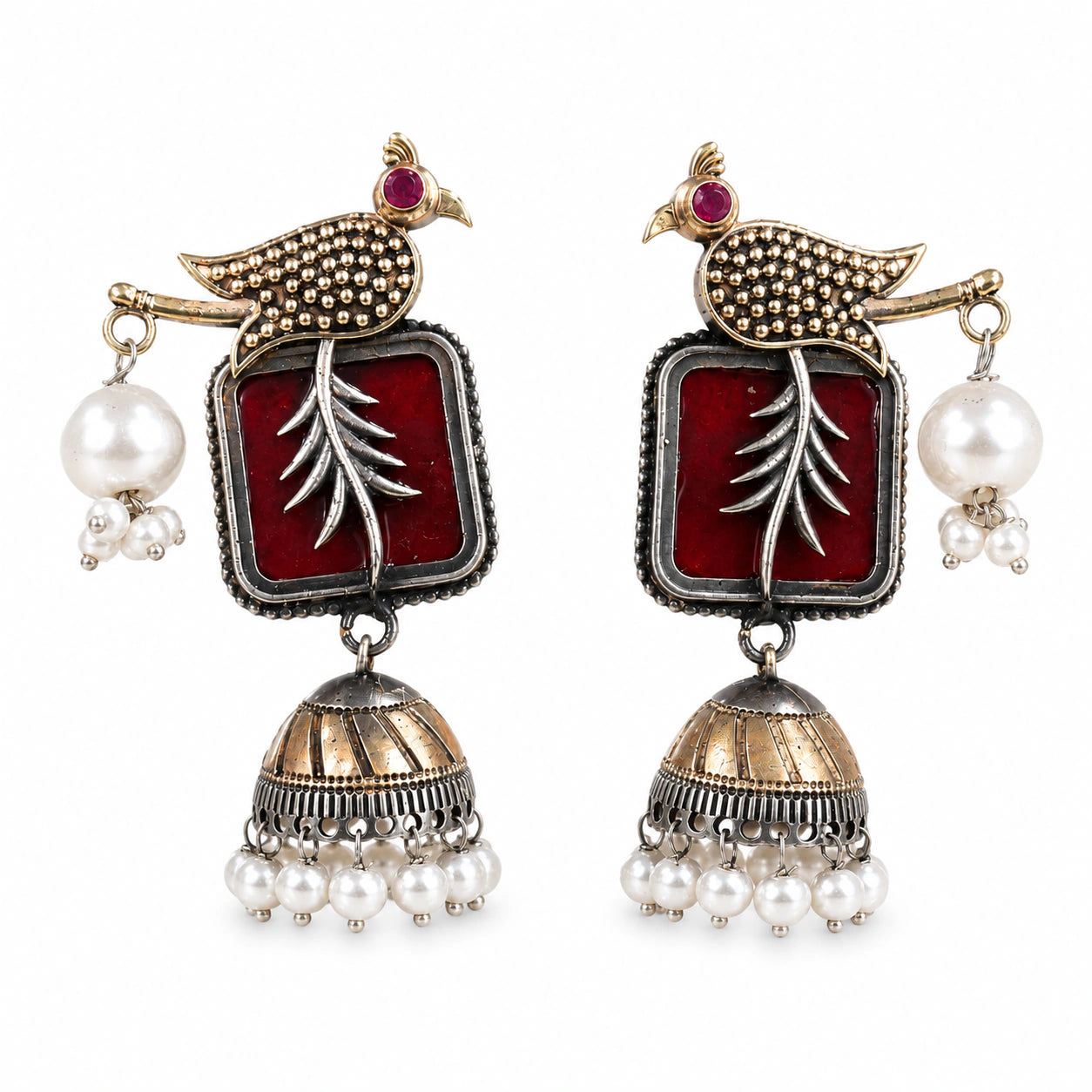Angled view of German silver maroon bird pearl jhumka earrings