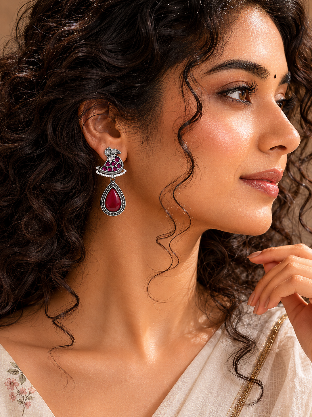 German silver maroon pearl bird dangle earrings worn by a model