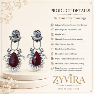Product details card for German silver maroon pearl bird-motif earrings