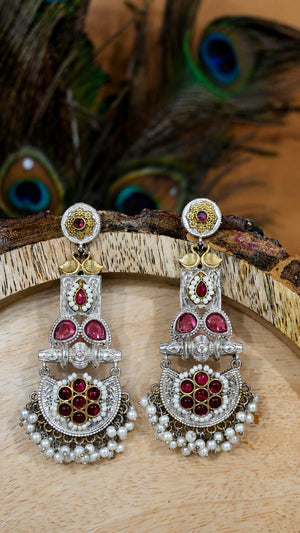 Close-up ear view showing maroon accents and layered pearl-style drops