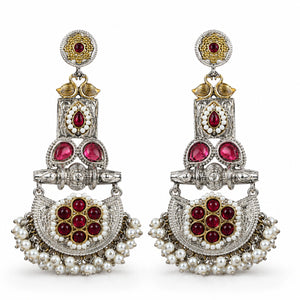 Close-up of maroon accents, pearl-style beads and chandelier detailing