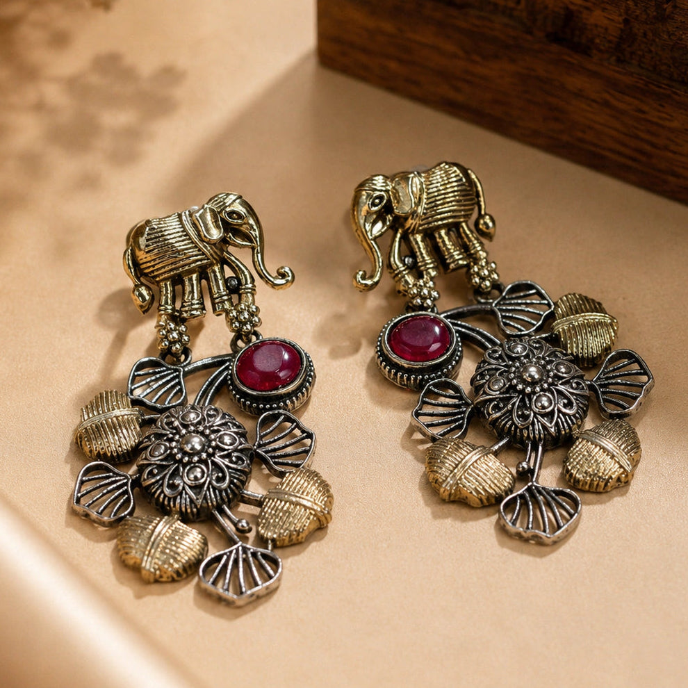 Angled view of German silver maroon-stone chandelier earrings