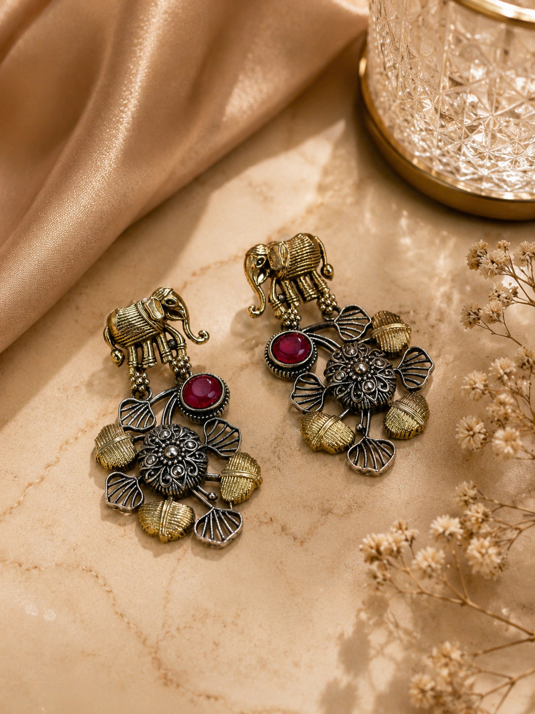 German silver maroon-stone chandelier earrings worn by a model