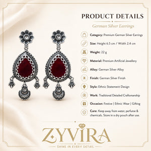 Product details card for German silver maroon teardrop floral dangle earrings