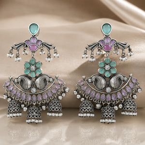 Angled view of German silver mint purple pearl chandelier earrings
