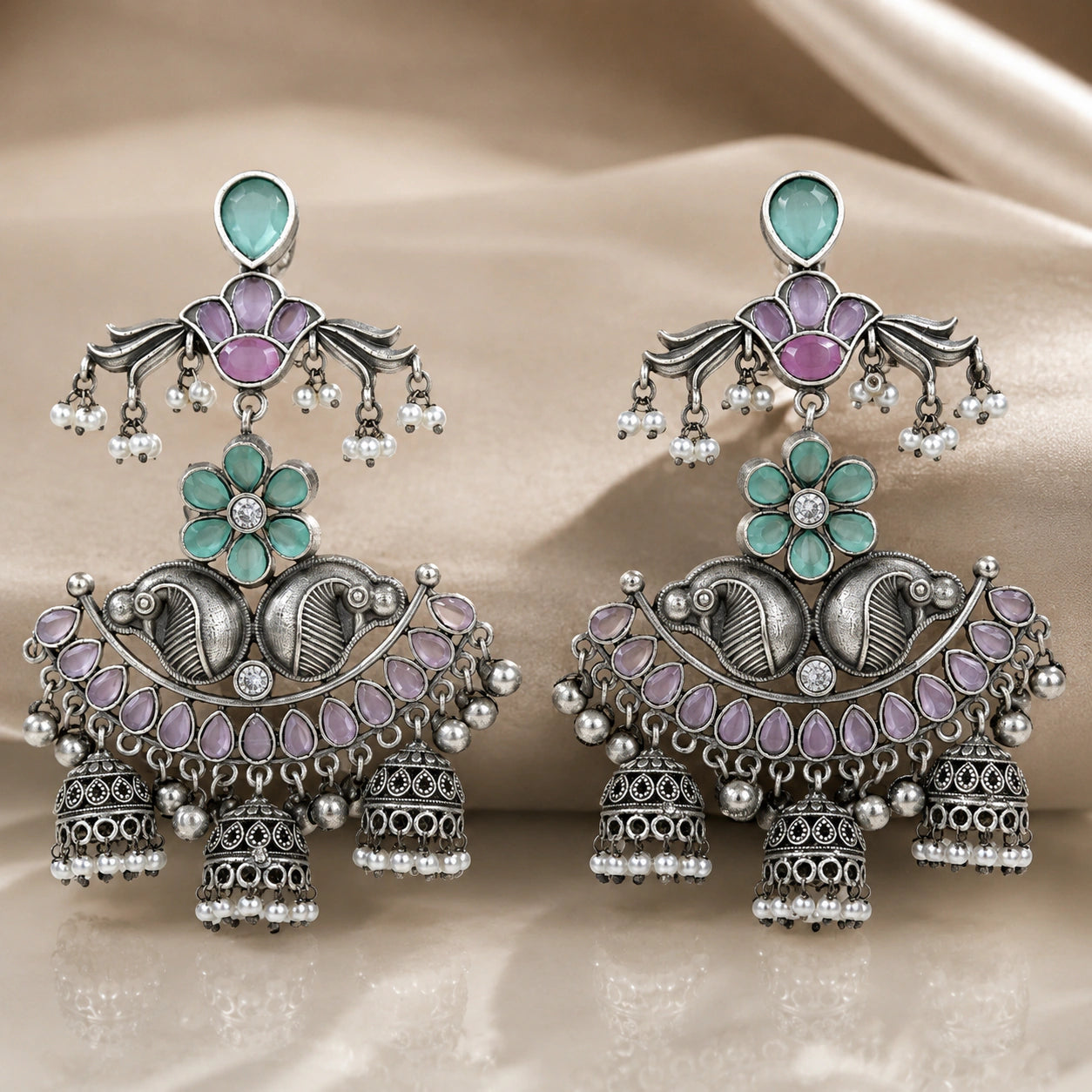 Angled view of German silver mint purple pearl chandelier earrings