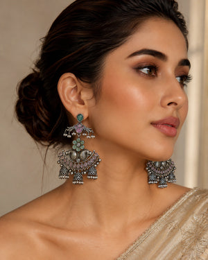 German silver mint purple pearl chandelier earrings worn by a model