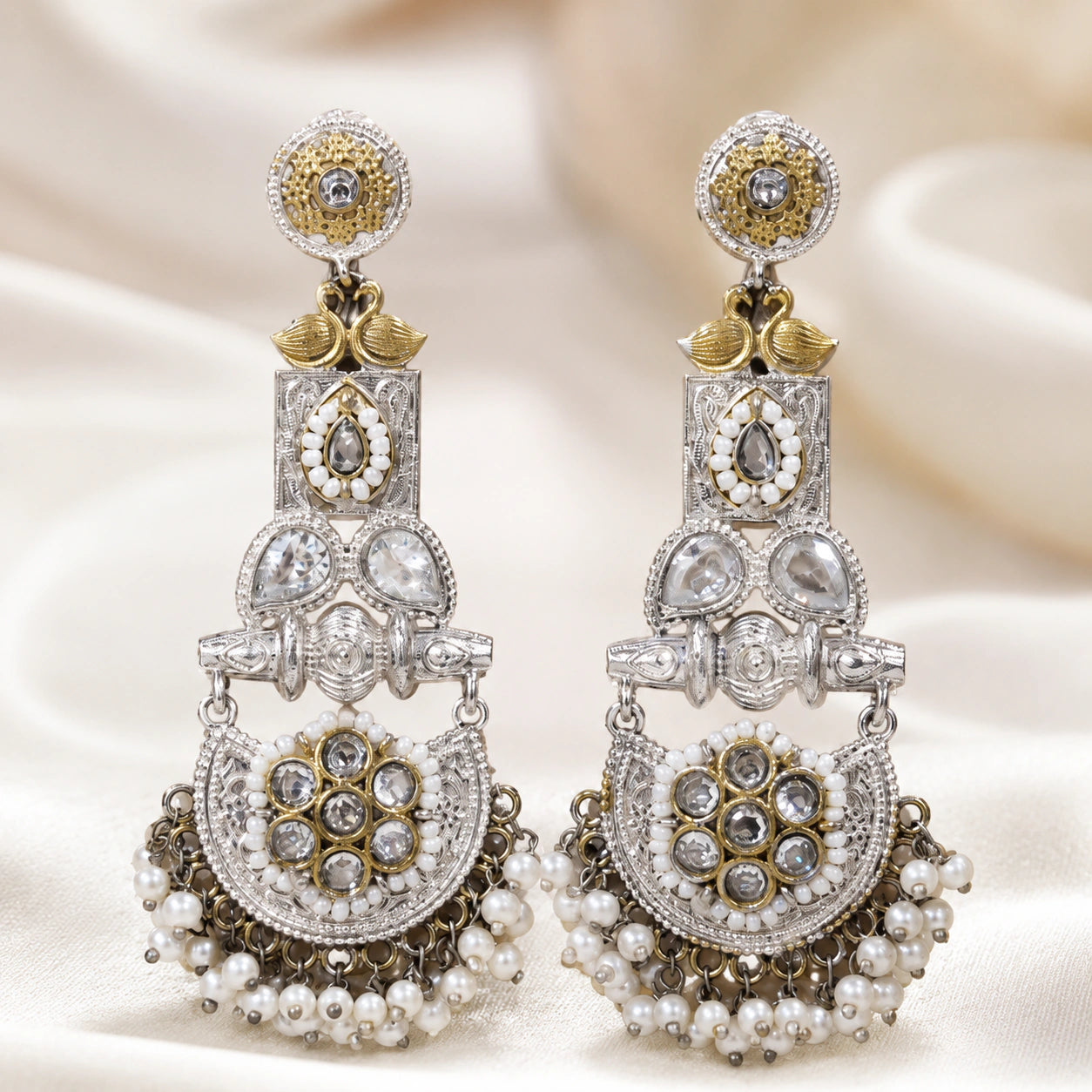 Angled view of German silver pearl-style crystal chandelier earrings