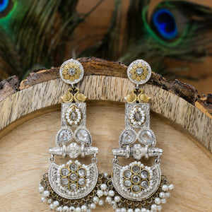 Pearl-style crystal chandelier earrings styled in an elegant jewellery flat lay